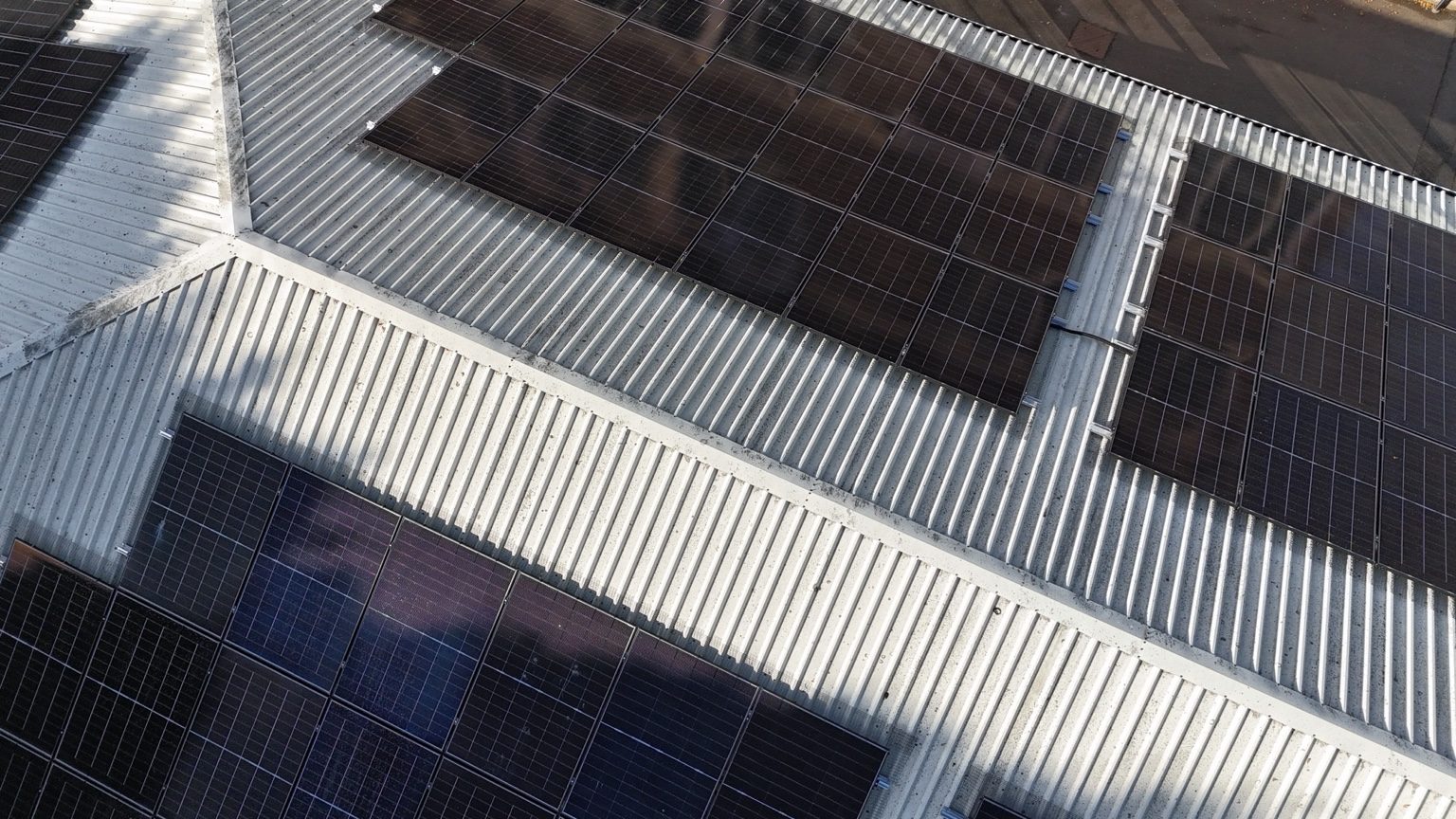 Closer aerial view of solar panels and roof details